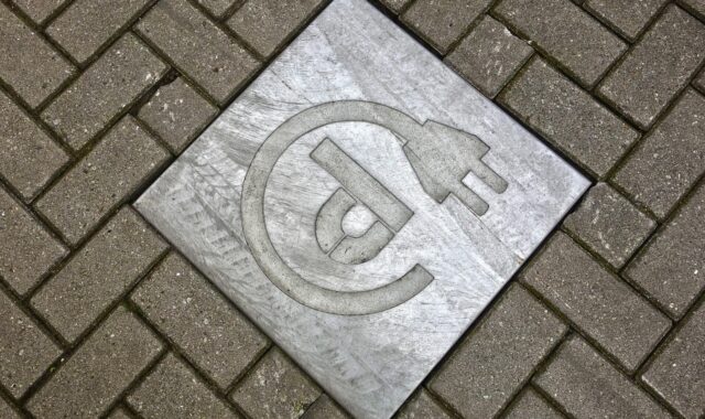 tile, street, car wallpapers, pavement, sidewalk, stone, symbol, icon, power plug, loading, car, power point, electric car, brown car, brown street, brown power